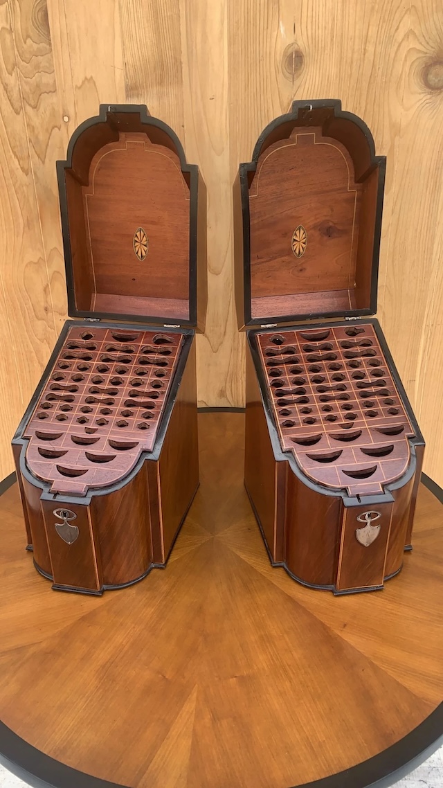 A rare matching set of walnut knife boxes with beautiful curves and intricate detailing