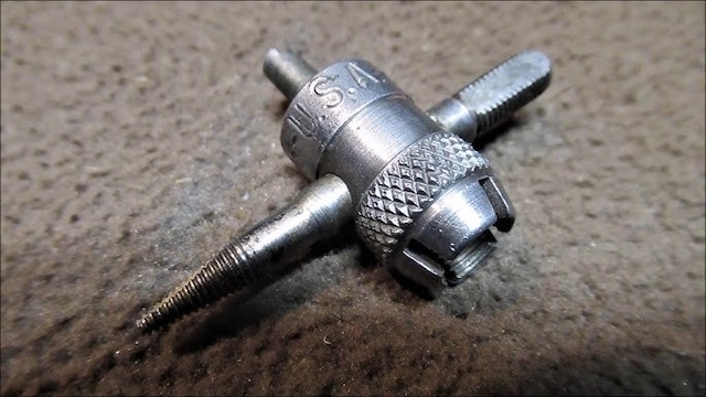 A closer look at the metalwork of this vintage tire valve stem remover