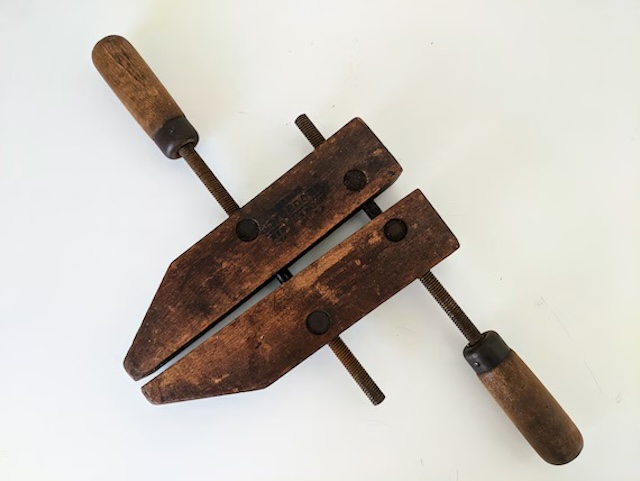 A close-up of the clamp’s durable wood and iron components, proving that the vintage adjustable wood clamp was built to last through generations