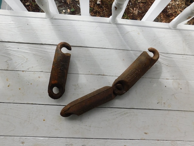 Rusted and well-used, these antique window sash weights once worked quietly behind the scenes in homes.