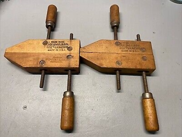 A pair of classic vintage adjustable wood clamps—sturdy, reliable tools that reflect the golden age of woodworking