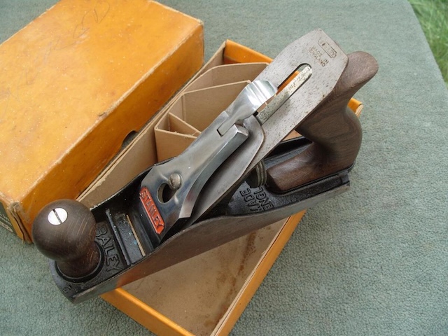 A close-up of the iconic Stanley wood plane, highlighting the precision craftsmanship that helped shape wood into fine furniture