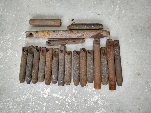 A mix of assorted vintage window weights, used to perfectly balance old wooden windows, now relics of the past.