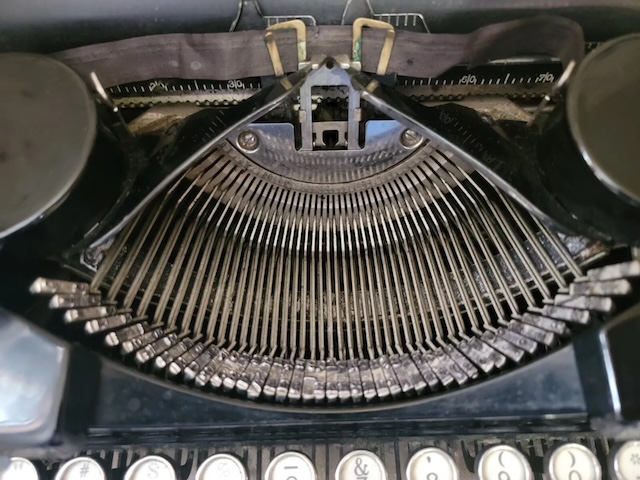 Precision and engineering, captured in the typebars of an old typewriter