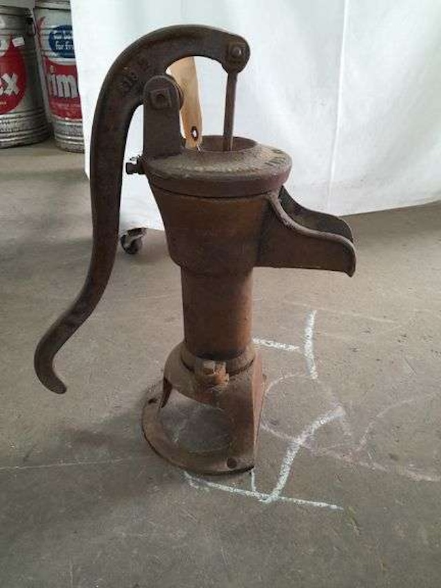 A rustic, yet still sturdy, Fairbury hand pitcher pump—a piece of history that once brought life-sustaining water to homes.