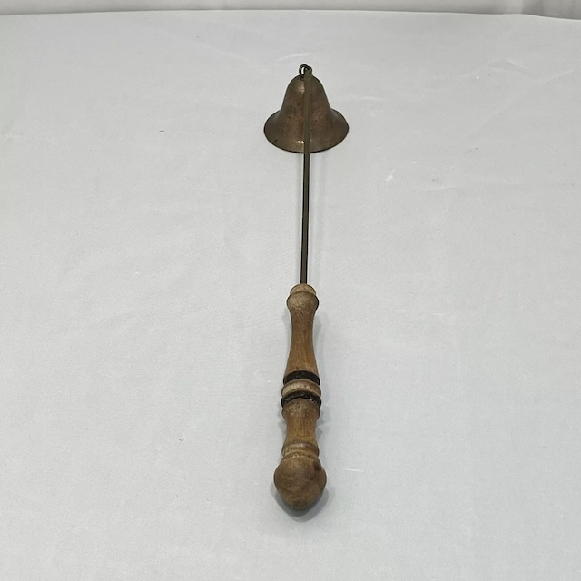 Classic Brass Candle Snuffer with Wooden Handle – A vintage tool blending brass with a wooden handle, designed for both elegance and ease when managing candlelight.