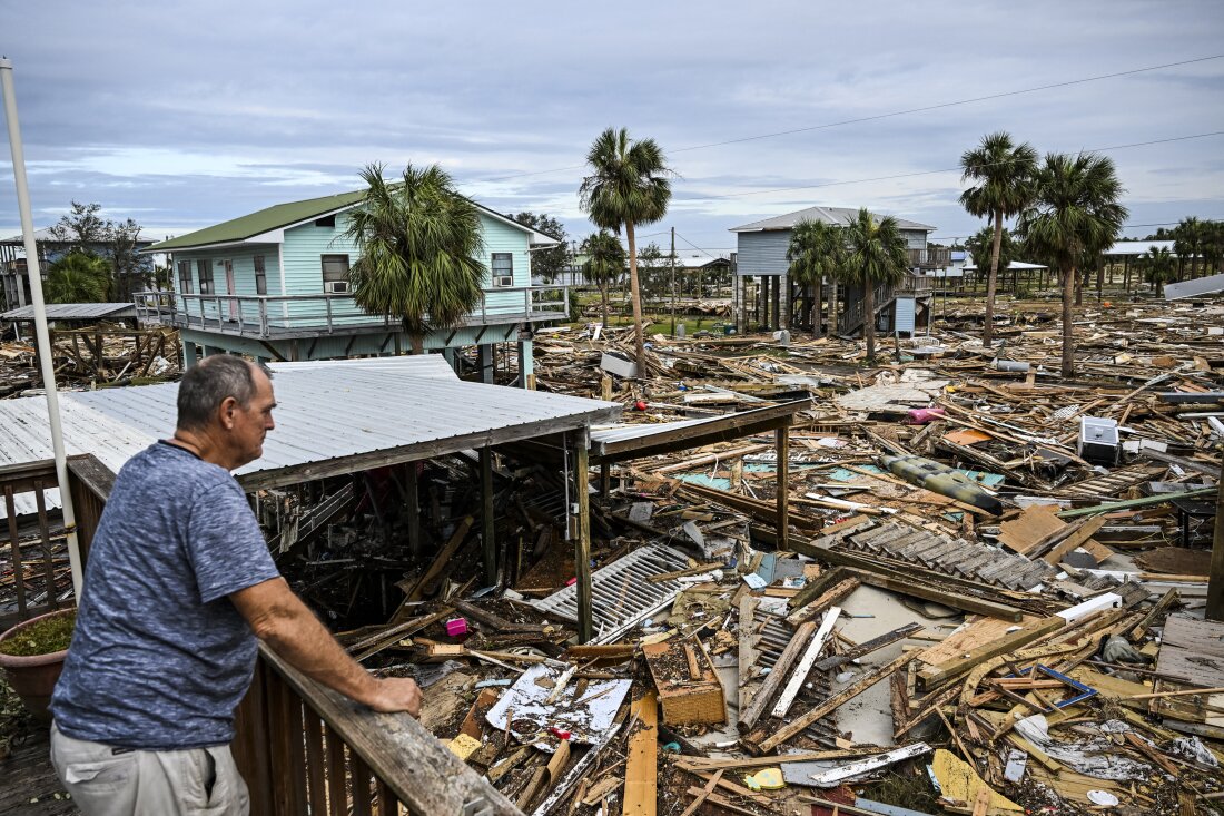 A Florida resident looks over the wreckage of his community after Hurricane Helene. With homes in ruins and debris scattered everywhere, residents now face the difficult task of preparing for Hurricane Milton's arrival.