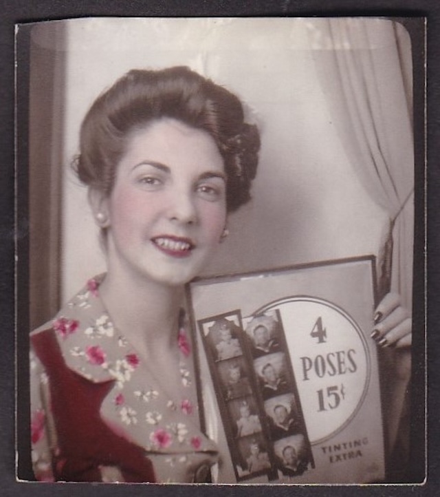 A woman holds a photobooth strip of four poses for 15¢, capturing the fun and affordability of vintage photobooths.