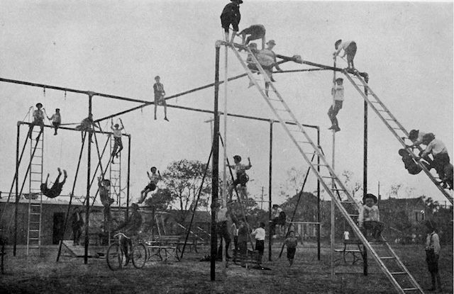 Kids enjoy a towering playground, defying the basic safety standards of today