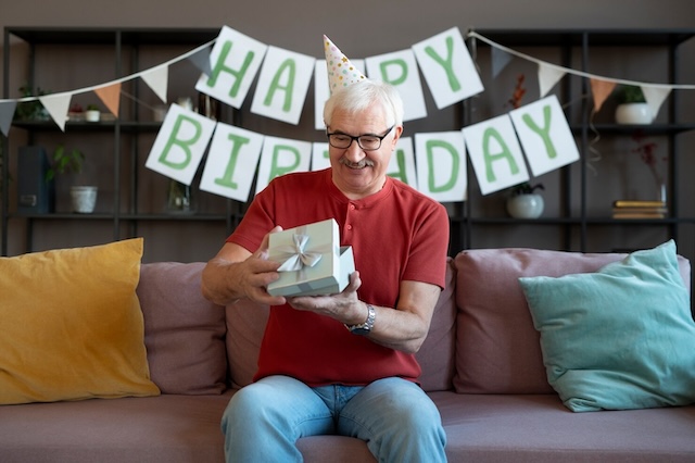 Gregory celebrates his birthday with joy, opening a surprise gift, not knowing an even bigger gift awaits him