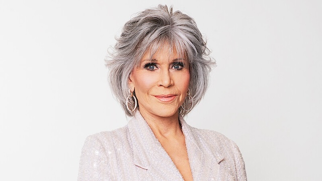 Jane Fonda, a renowned Hollywood actress, and advocate for aging gracefully, proudly sporting her signature gray hair at a public event