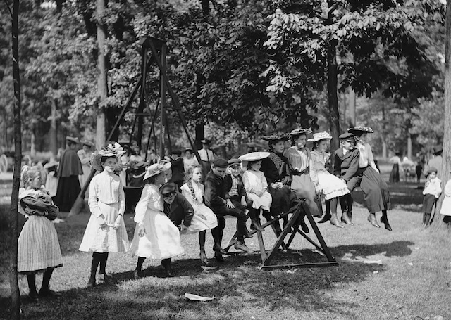 Children at Belle Isle Park in Detroit, with their formal attire not stopping them from having fun