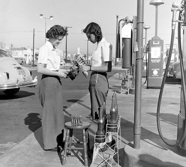 The casual atmosphere of the gas station reflects how these places were once community hubs where people gathered during everyday tasks