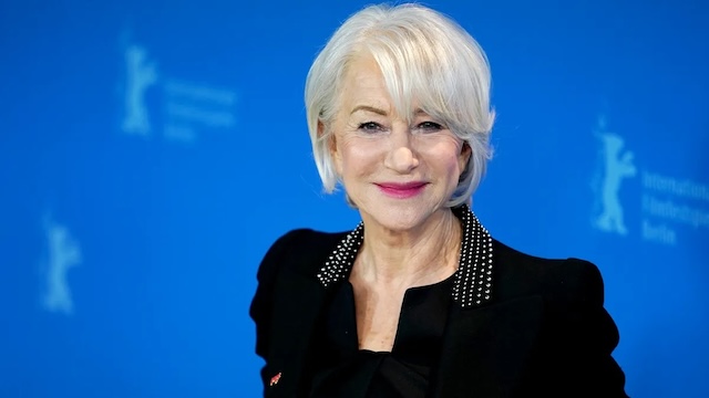 Helen Mirren, an iconic actress known for her elegance, embracing her natural gray hair while making a powerful statement about beauty at any age