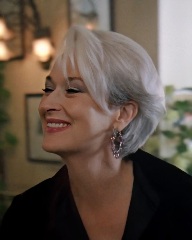 A chic and stylish older woman with a short silver hairstyle, proving that sophistication knows no age