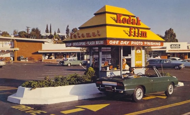 A drive-thru Kodak Fotomat booth, a convenient stop for one-day photo finishing before the digital age