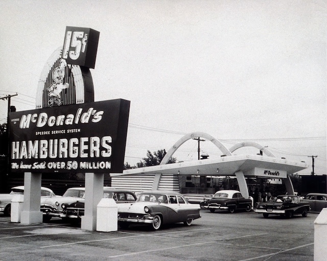 By this point, McDonald's had already sold over 50 million hamburgers. This sign reflects a pivotal moment in the brand's expansion during the mid-20th century