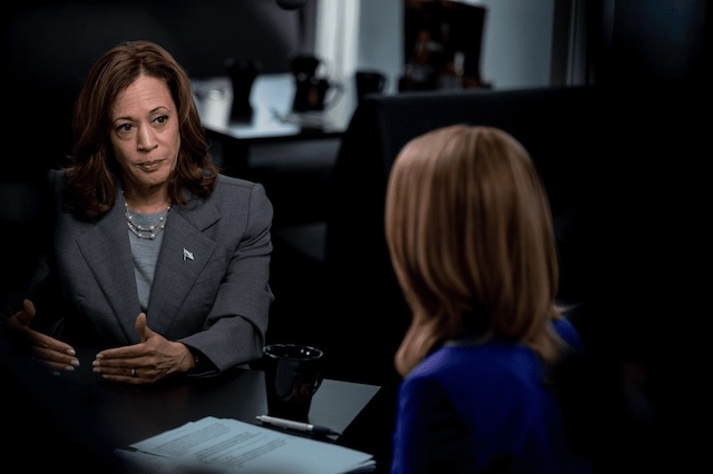  A serious discussion unfolds as a politician shares her thoughts during a live television interview, highlighting the intensity and unpredictability of live broadcasts