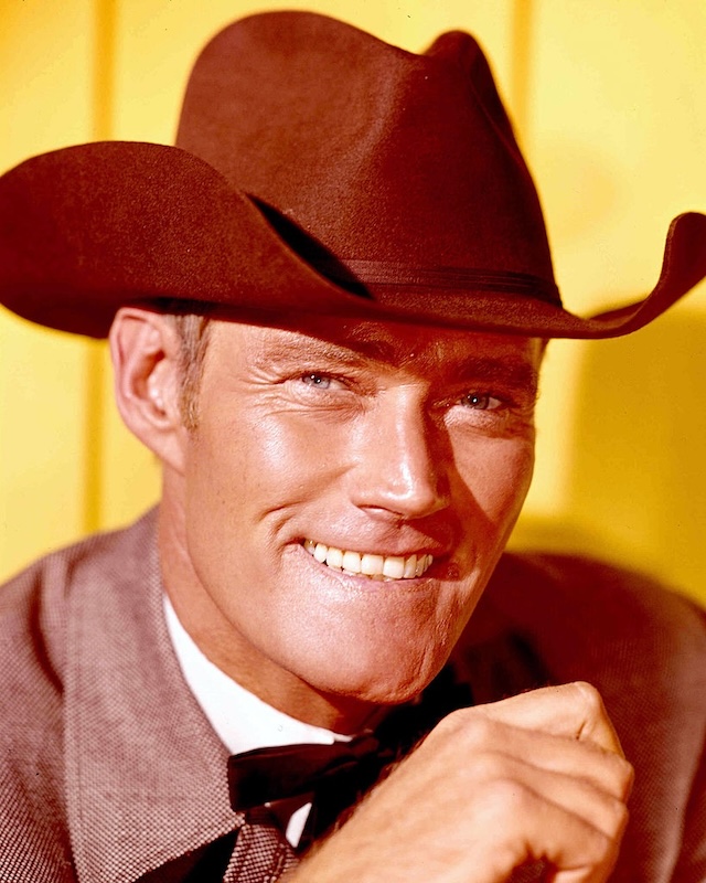 Chuck Connors as the iconic Lucas McCain in The Rifleman, a role that defined his career and brought his rugged charm to millions of viewers