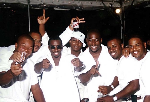 A group of friends enjoying the atmosphere at Diddy’s legendary White Party, known for its exclusive guest list and extravagant celebrations