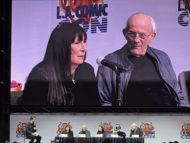 Morticia and Uncle Fester, brought to life by Anjelica Huston and Christopher Lloyd, engage in a panel discussion during the L.A. Comic Con