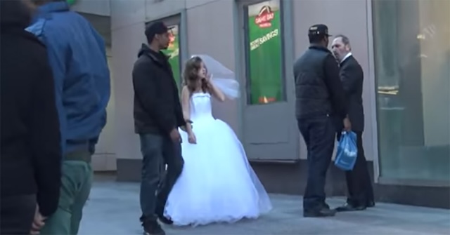 Onlookers start to intervene, as tensions rise in the staged scene designed to raise awareness about the global issue of child marriage