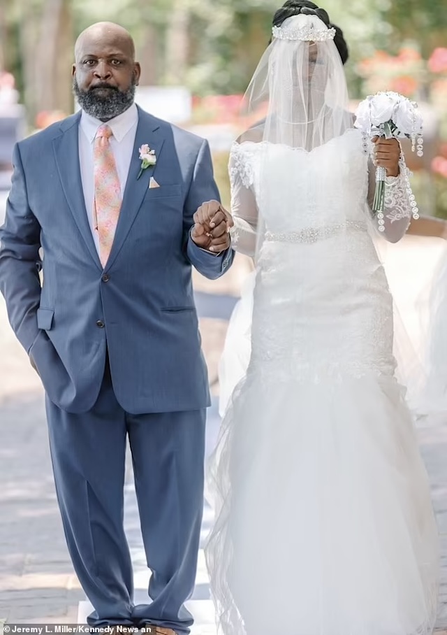 Miracle walking down the aisle with her father, Kareem Phillips, as he supports her in marrying the love of her life