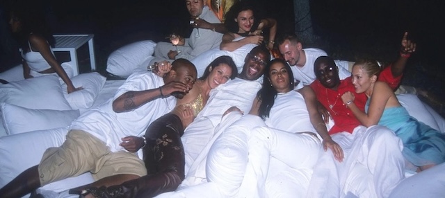 Celebrities enjoying a laid-back moment at one of Diddy's iconic White Parties, renowned for their opulence and high-profile guest list