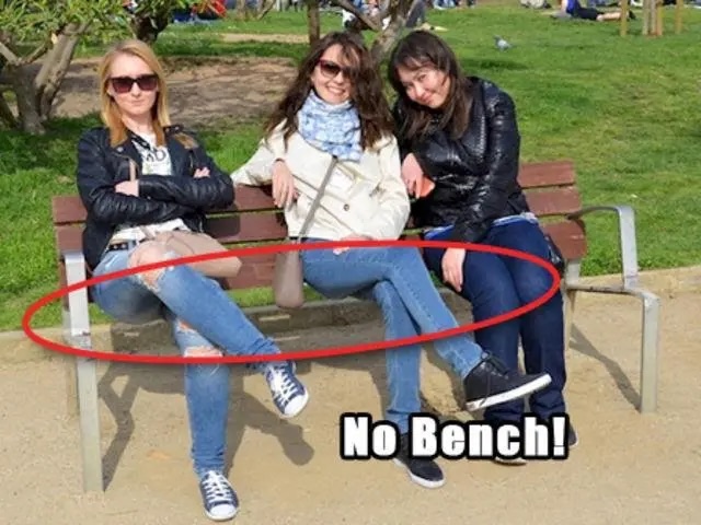 No bench! The friends are sitting as though on a bench, but the seat itself is missing. Did you spot it?