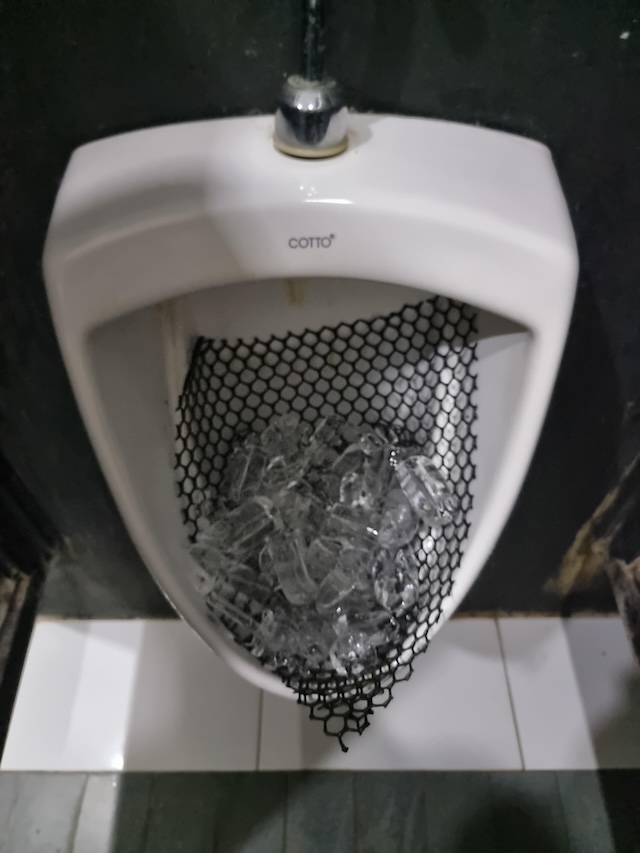 Ice in public restroom urinals serves as a cost-effective way to minimize bad smells and promote hygiene