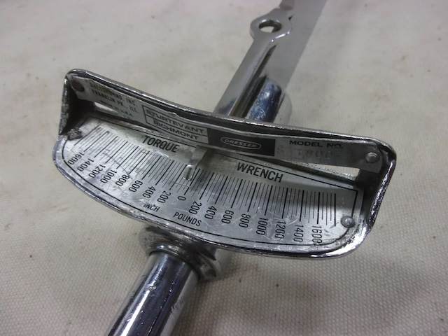 Close-up of the vintage torque wrench gauge, measuring torque in pounds, a tool prized for its precision in preventing overtightening