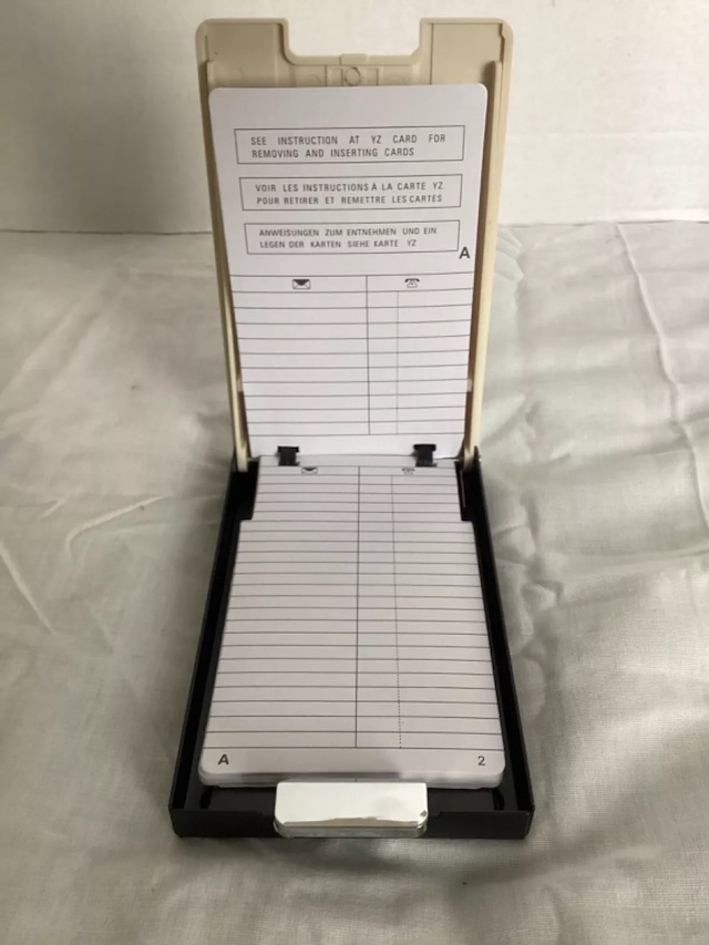 An open view of the vintage flip open address index revealing the card slots, ready to be filled with important contact details