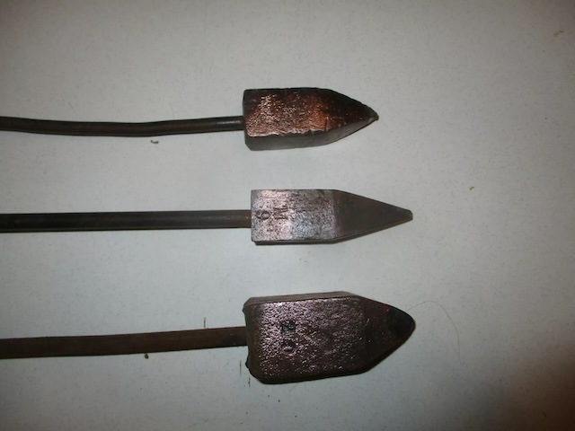 The copper tips on these vintage soldering irons showcase decades of use in various repair jobs