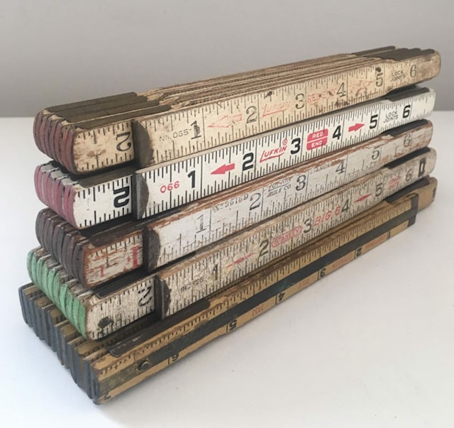 Here’s a classic folding wooden ruler with wear that tells the story of countless projects it once measured