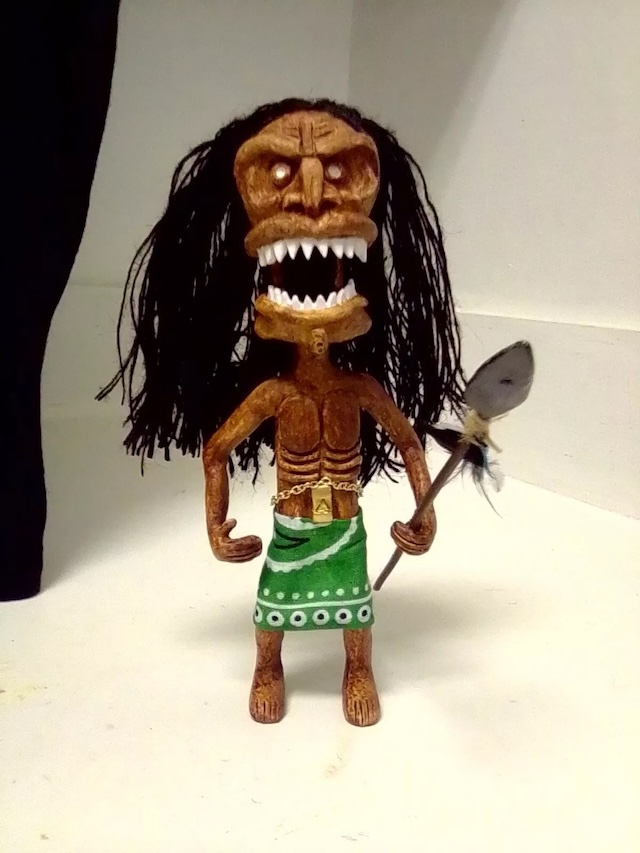 Another angle of the Zuni Fetish Doll, showing off its fierce stance and the spear it's gripping tightly. It became a memorable part of horror folklore in the 1970s