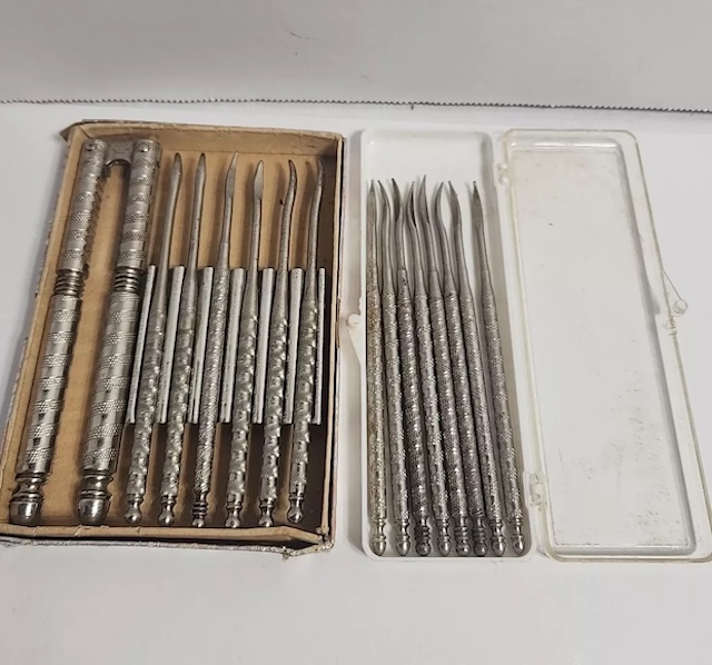 A complete set of vintage nutcracker silver stainless tools, displayed in a box, showcasing the fine craftsmanship of each piece