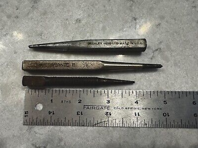 A set of vintage nail punches, once essential for carpenters and handymen to drive nails just below the surface of woodwork