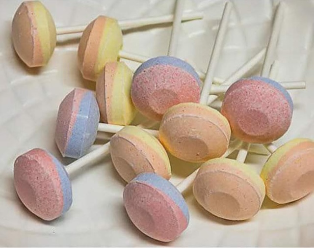 A bunch of Sweet Tart Double Lollies in various colors that bring back memories of schoolyard snacks and candy store visits