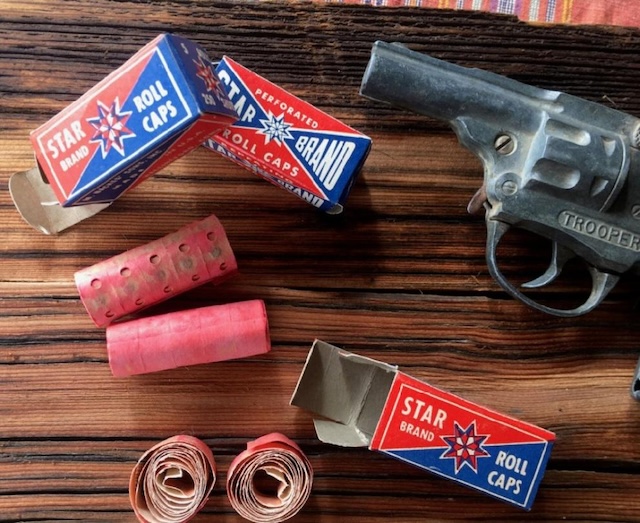 The heart of the toy—vintage cap rolls—fueled countless imaginary gunfights and wild adventures. A classic accessory no young cowboy or adventurer would go without!