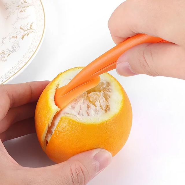 Using a citrus peeler to perfectly remove the peel. No more sticky fingers!