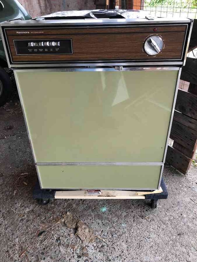 This vintage Kenmore portable dishwasher with its charming wood-paneled look brings back memories of the 1980s. A nostalgic reminder of simpler, yet effective kitchen appliances