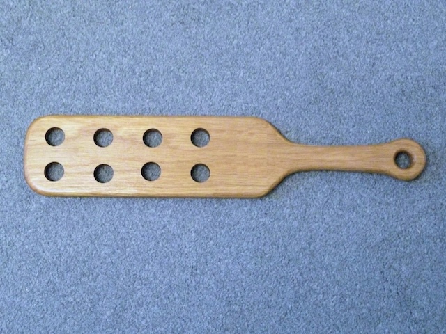 An iconic relic from the past, this vintage wooden paddle is a reminder of old school discipline methods used to maintain order