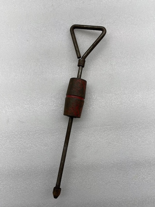 With its unique design and handle, this vintage auto dent puller was a garage essential for every DIY car enthusiast