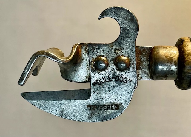 The "Bull-Dog" tempered steel can opener, a rugged tool that was once a reliable companion in kitchens for opening cans