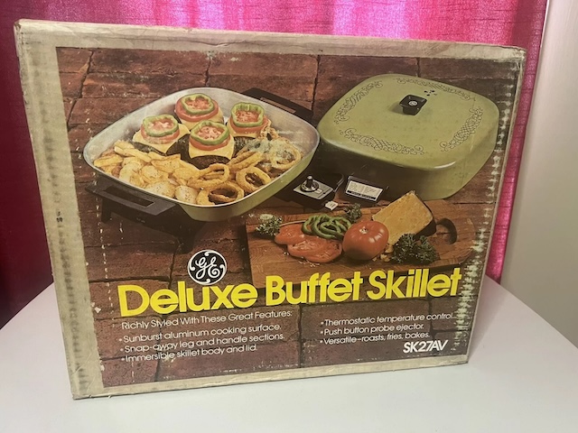 The original box of the GE Deluxe Buffet Skillet, showcasing its multi-functional cooking options. A reminder of a time when electric skillets were a must-have in the kitchen