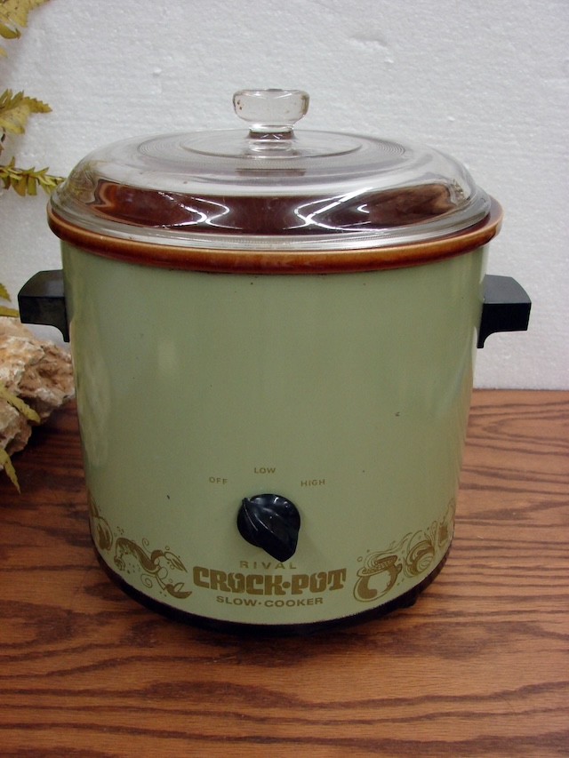 A closer look at the Rival Crock-Pot slow cooker from the 1970s, showcasing its minimalist design and simple functionality