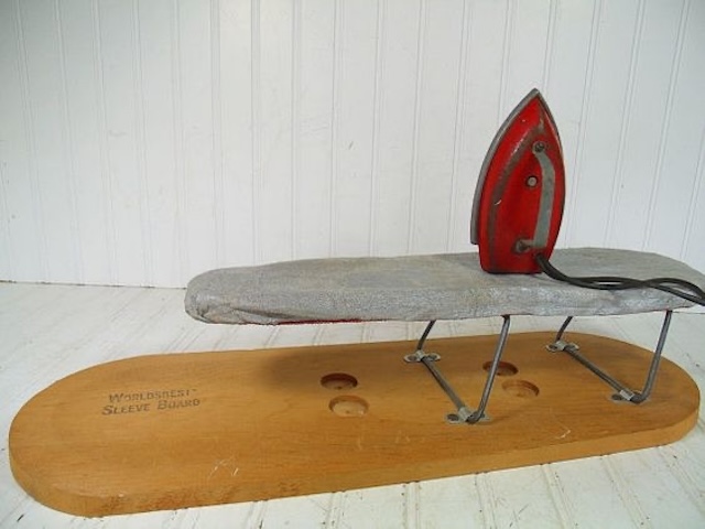 A close-up look at the vintage sleeve ironing board, an essential for anyone serious about their ironing game back in the day!