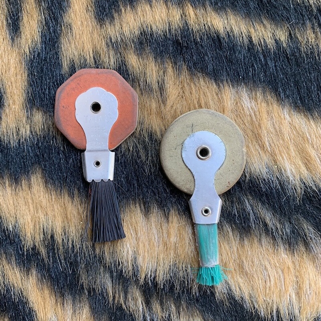 These vintage typewriter erasers, featuring rubber wheels and brushes, bring back memories of old office desks and the challenge of making clean corrections