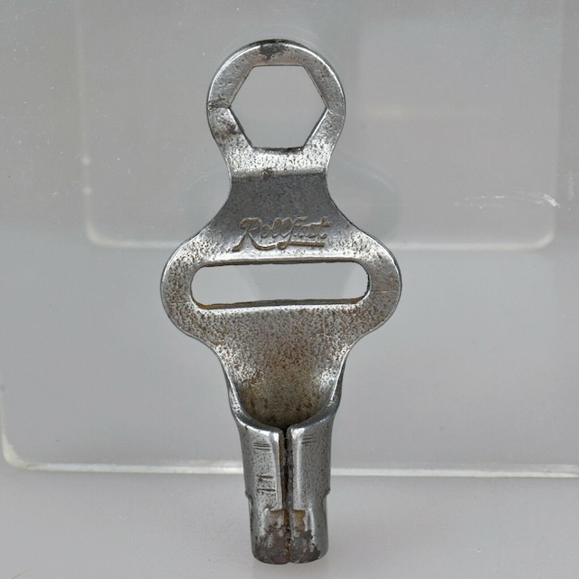 A chrome roller skate key branded 'Rollfast' - a true relic of vintage skate culture