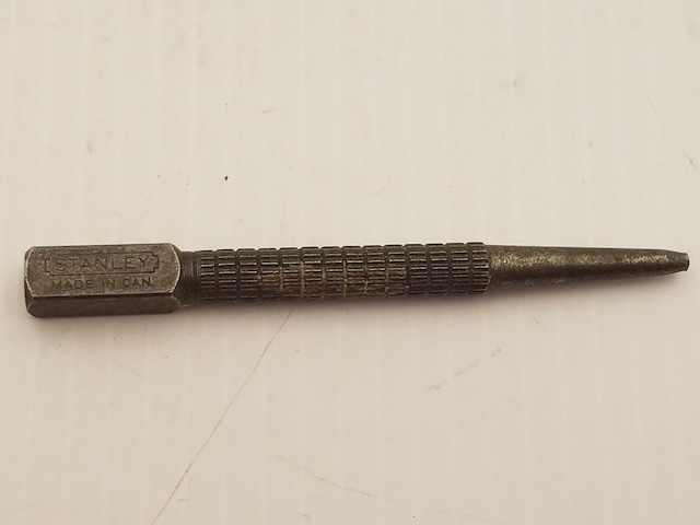 This particular vintage nail punch, stamped 'Stanley,' harkens back to an era of quality craftsmanship in every tool